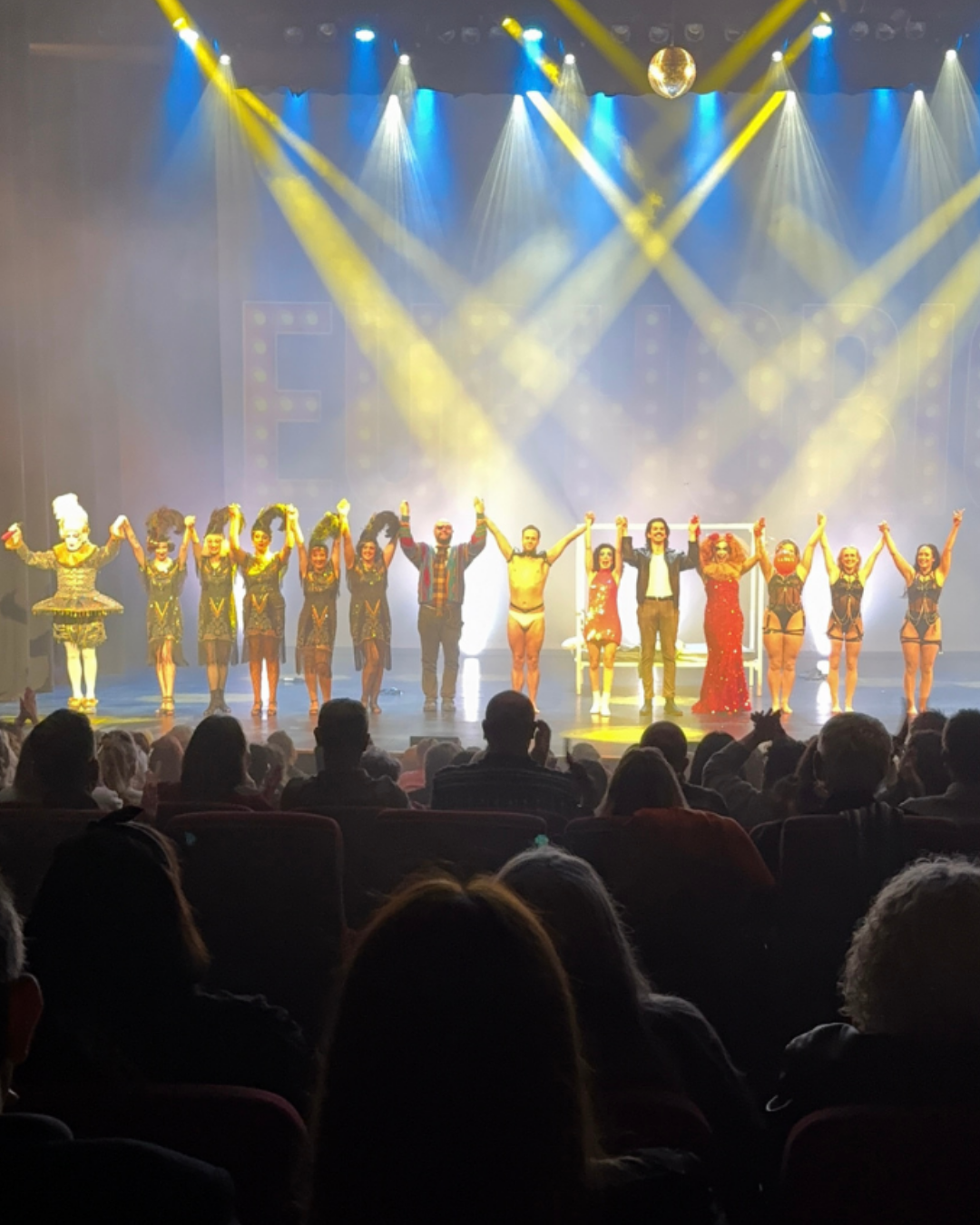EUPHORIC performers in a cinematic stage light